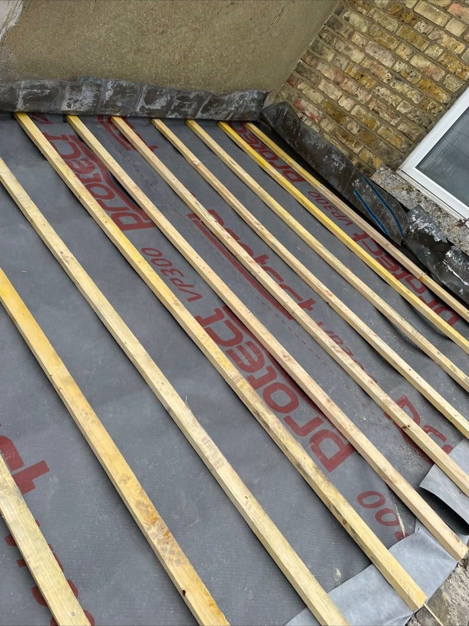 The same roof with new breathable membrane and new timber battens fixed across it